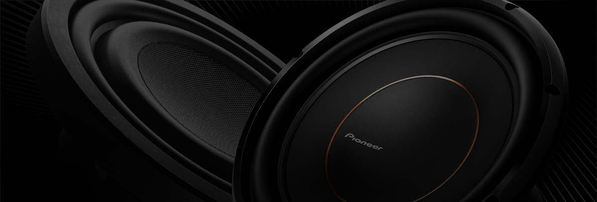 Two subwoofers on dark background