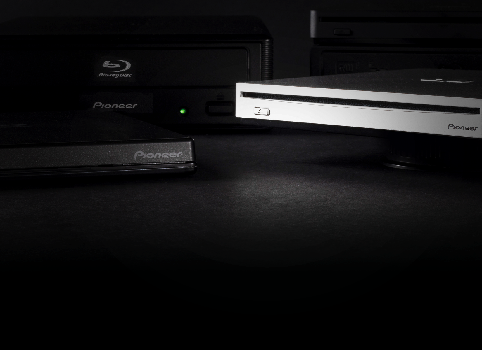close up of optical drives on black background
