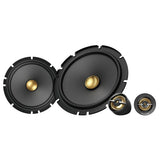 Set of car speakers with gold cones on a white background