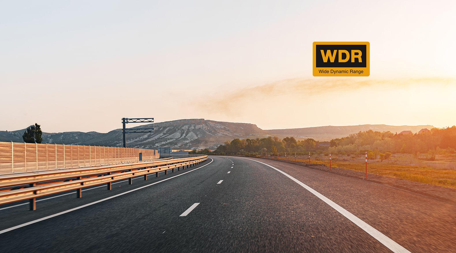 Long stretch of road with a mountainous landscape and 'WDR' logo in the corner.