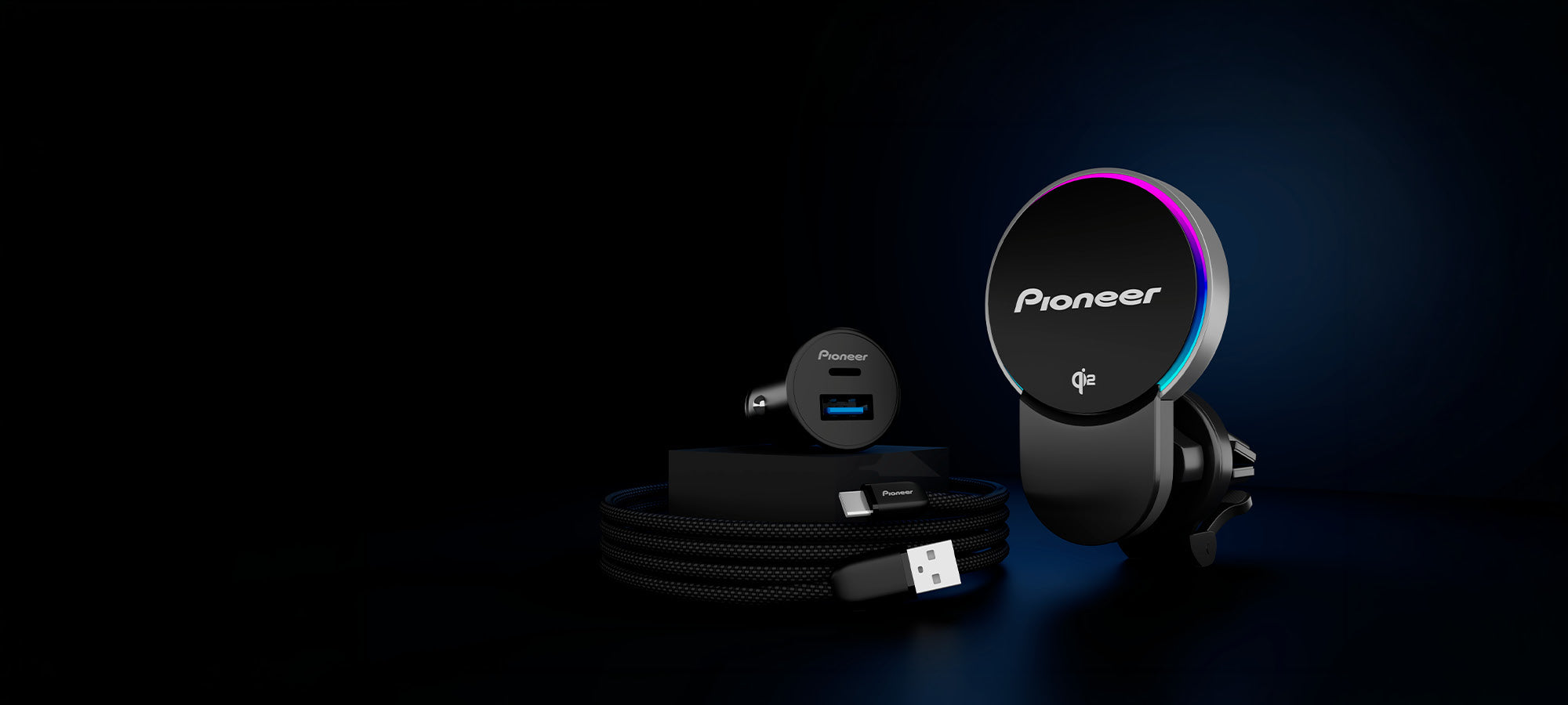 Pioneer car dashboard kit with air vent mount, USB cable, and car charger on a dark background